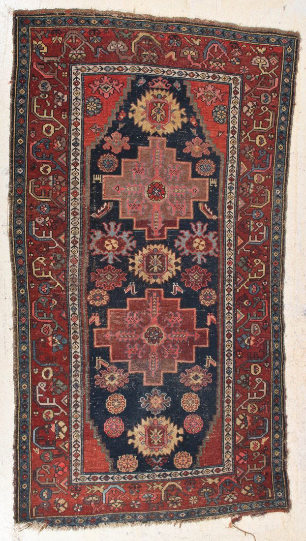 West Persian Kurd Rug: West Persian Kurd Rug, circa 1900, frayed ends, areas of wear. Size: 6' 11" x 3' 9".
