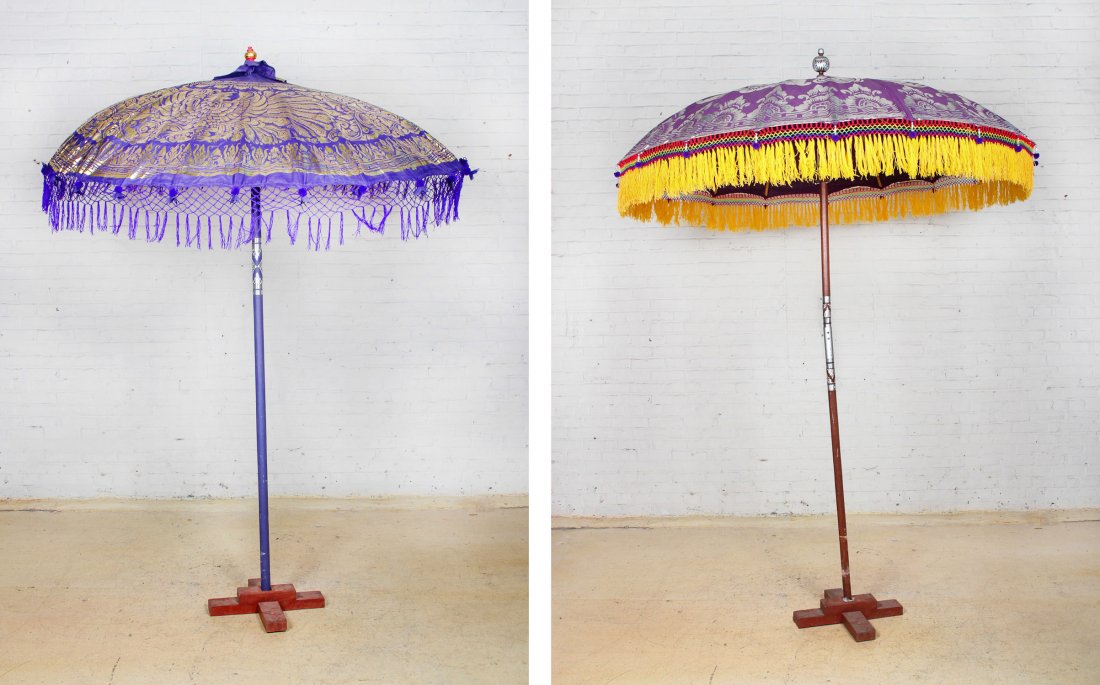 Two Large Southeast Asian Sunbrellas: Two Large Southeast Asian Sunbrellas. Size: 94 x 70 and 102 x 73 inches. Key attached.