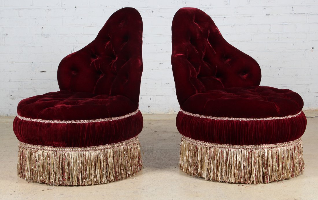 Two Red Tufted Velvet Swivel Chairs: Two Red Tufted Velvet Swivel Chairs. Size: 36.5 x 26 x 32 inches.