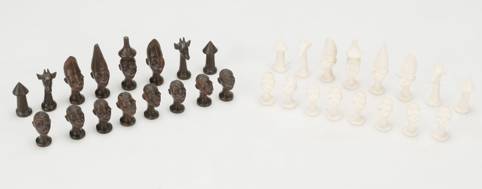 Makonde/Tanzania (African/Africa) Chess Set, Published: A Mid 20th Century Makonde ebony wood versus bone Tanzanian chess set. King is 4" (6 cm) and Pawn 1.5" (4 cm) high. Exhibited/Published: Schachspiele Wandel Im Laufe Der Kunst Und Kulturgeschichte (Ch