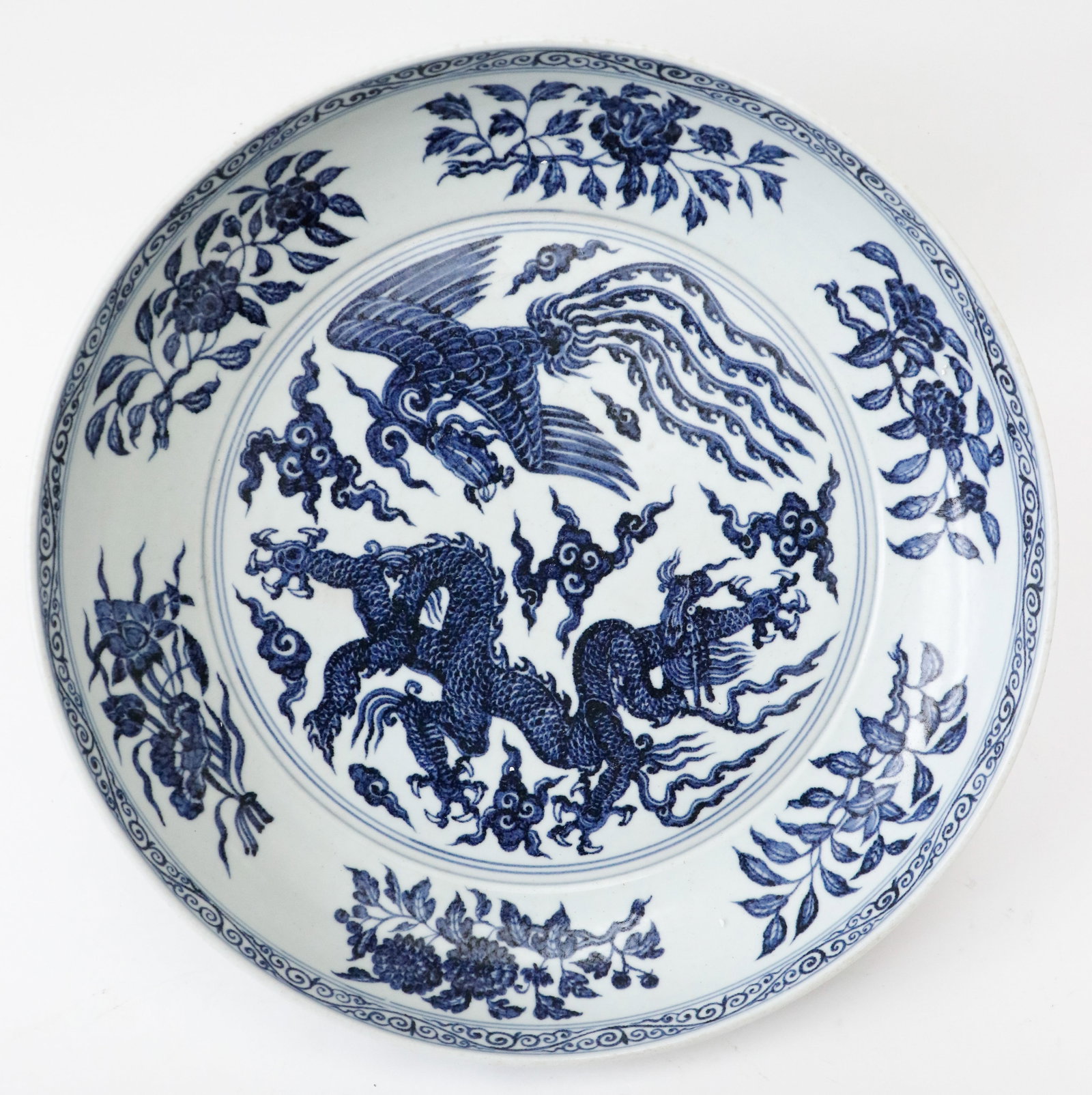 Chinese Porcelain Blue And White Charger With Phoenix and Dragon: Chinese Porcelain Blue And White Charger With Phoenix and Dragon. Unmarked. Size: 15.5'' x 15.5'' x 3'' (39 x 39 x 8 cm).