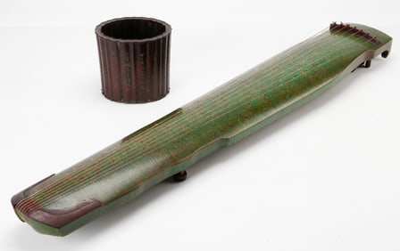 Chinese Guqin Stringed Musical Instrument And A Brush Pot