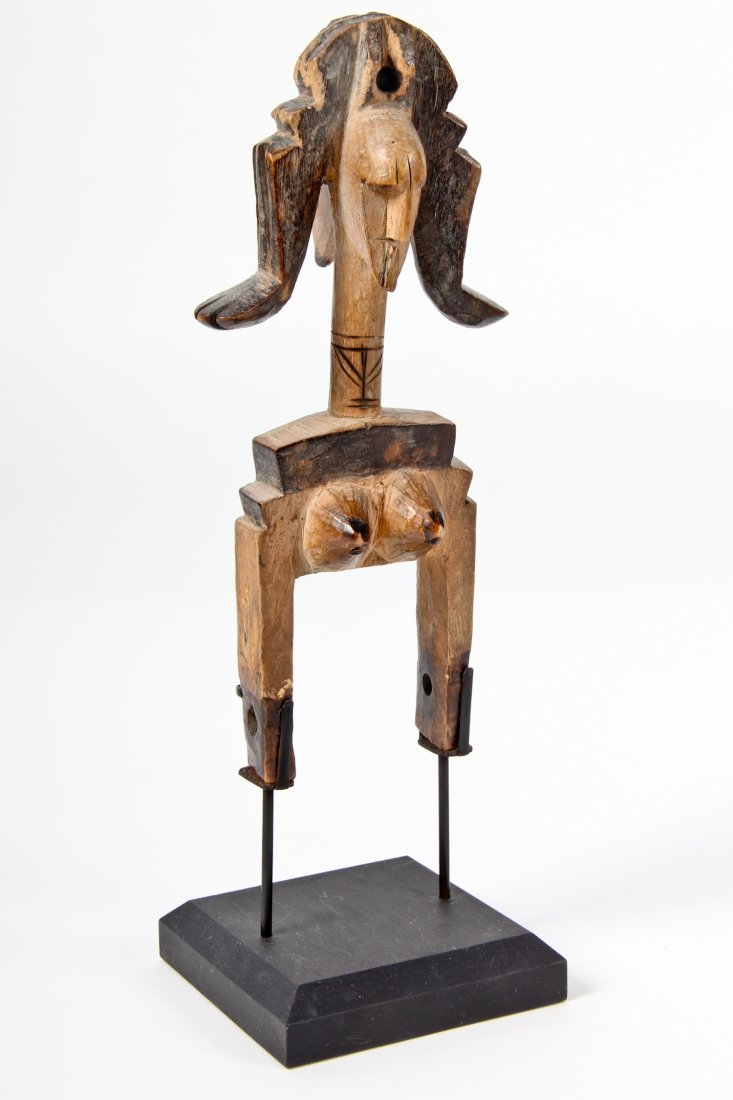 West African Narrow Strip Heddle on Stand: West African Narrow Strip Heddle, early 20th c, carved wood, patina. Size: 8" x 3.5" x 2" (figure). Provenance: Jane Steinsnyder.