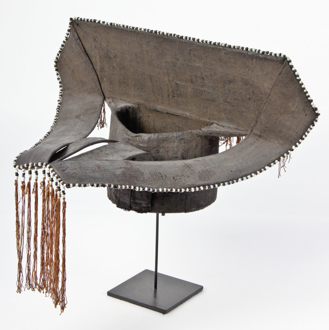 Southeast Asian Headdress: Southeast Asian Headdress, possibly Yao, early 20th c, stand included. Size: 12" x 22" x 14" (headdress). Provenance: Jane Steinsnyder.