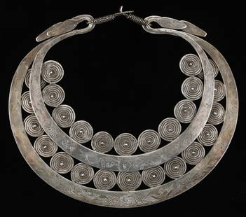Antique Miao Silver Torque, China: Antique Miao Silver Torque, China. Double crescent silver torque with incised patterning and wound wire spirals soldered to the inside of each crescent. Flattened reversed terminals with incised decor