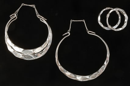 Two Antique Miao Silver Torques and Two Silver Bracelets, China