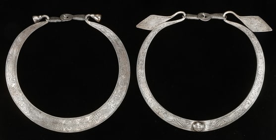 Two Antique Miao Silver Torques, China