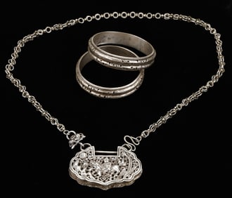 Antique Silver Miao Necklace and Pair of Unspecified Bracelets, China