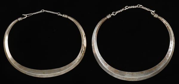 Two Antique Shui Silver Torques, China