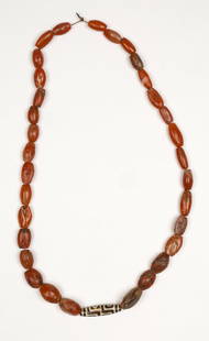 Antique Miao Tzi Bead Necklace, China: Antique Miao Necklace, China. Necklace of jasper and carnelian beads, with a tzi bead at the base. Size: 16'' (41 cm). Provenance: Ex. Roger Hollander collection.