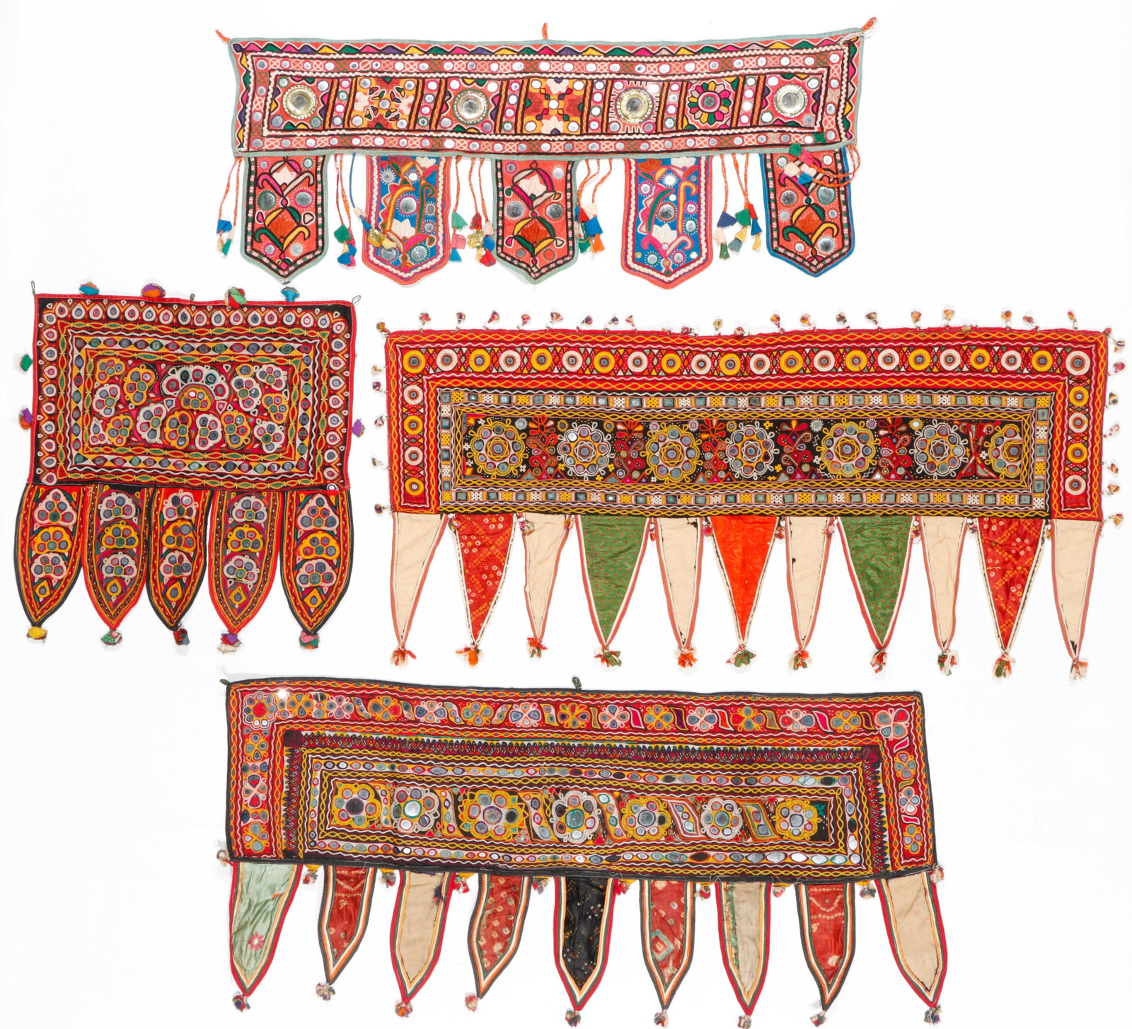 4 Indian Toran Door Hangings with Mirrorwork: 4 Indian Toran Door Hangings with Mirrorwork. Cotton with mirror disks and embroidery. Sizes Ranging From: 1'8'' x 1'10'' (51 x 56 cm); to: 3'8'' x 1'9'' (112 x 53 cm). Provenance: Collection of Brook