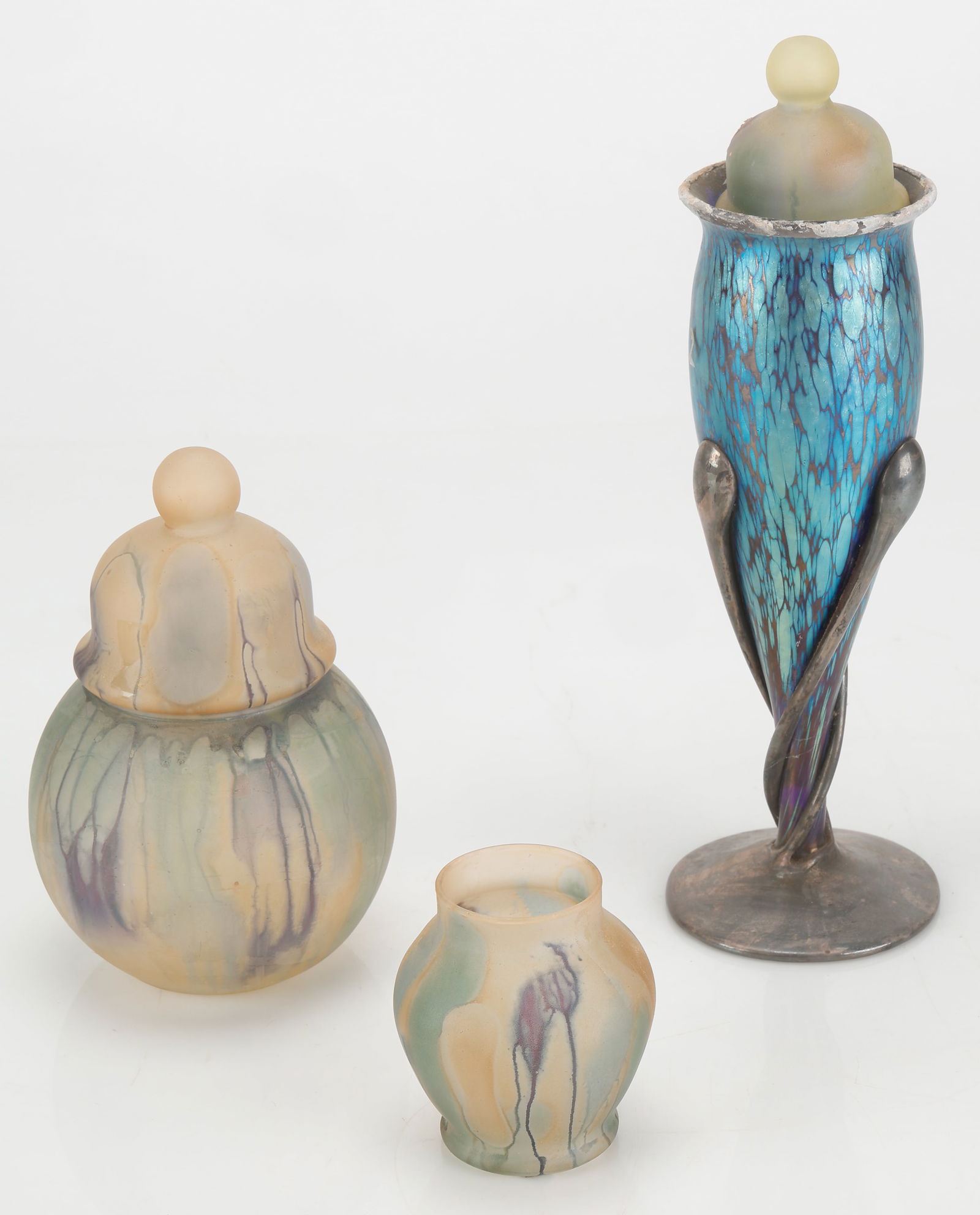 Collector's Lot of Art Glass (3 Pieces): Collector's Lot of Art Glass (3 Pieces). Including a blue iridescent glass vase in the style of Loetz with silver overlay; and two covered jars, one marked: Nouveau art glass hand painted by Reuven. H