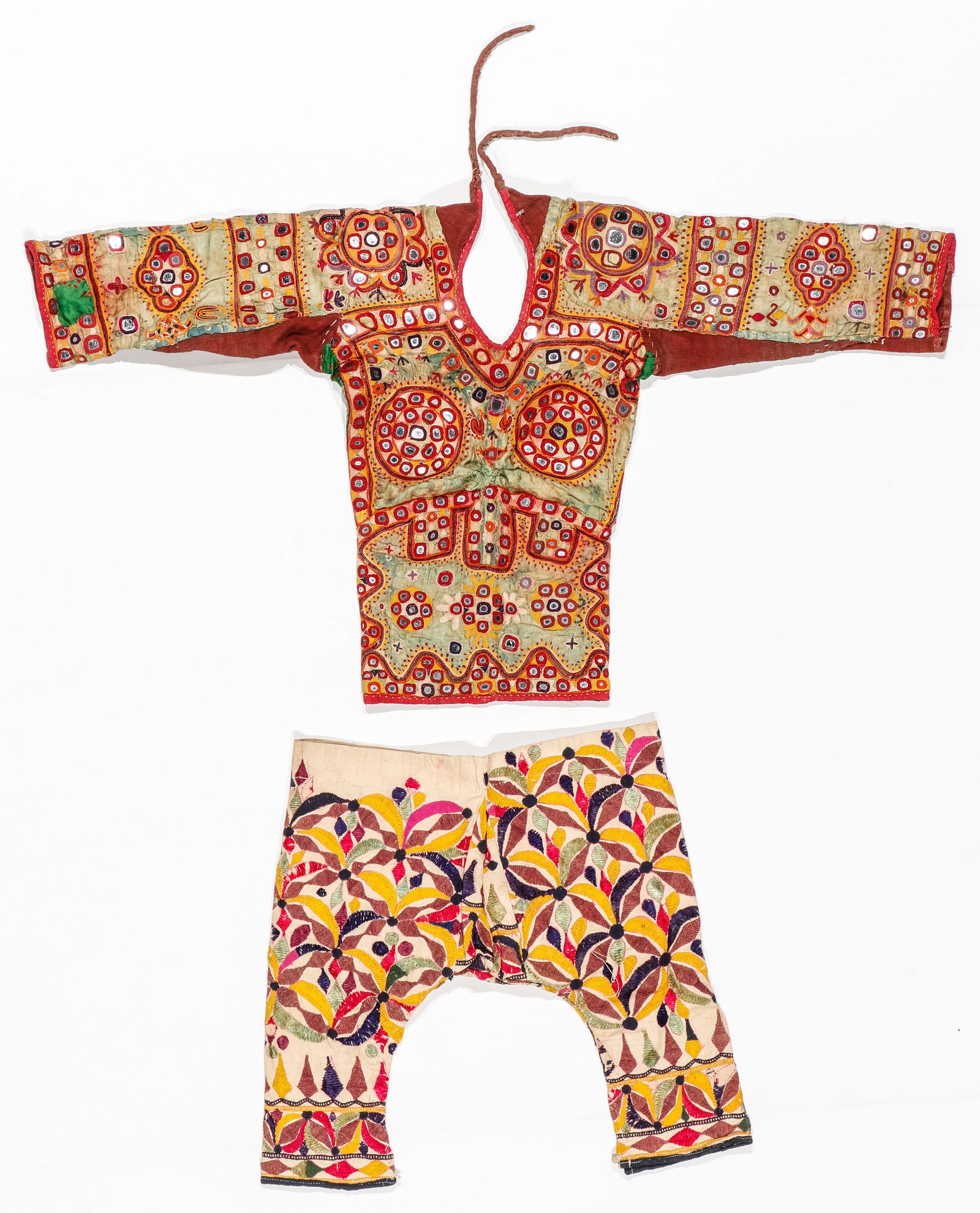 Kutch Mirrorwork Choli Blouse and Embroidered Trousers, India, Early/Mid 20th C.: Kutch Mirrorwork Choli Blouse and Embroidered Trousers, India, Early/Mid 20th C. silk floss embroidery on cotton. Sizes: 1) 2'11'' x 1'6'' (89 x 46 cm); 2) 1'6'' x 1'6'' (46 x 46 cm). Provenance: The
