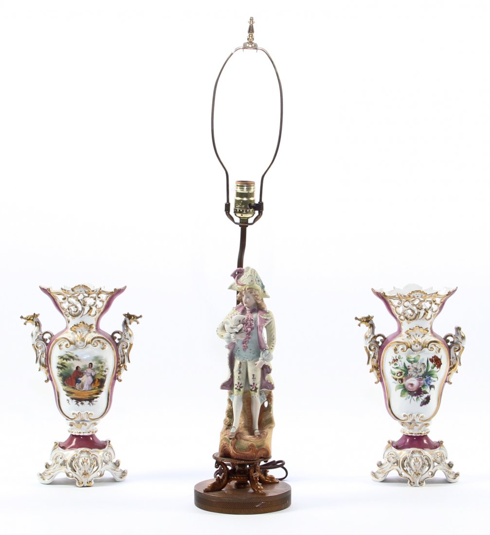 Decorative 3pc Mixed Porcelain Garniture Lot: Decorative 3pc Mixed Porcelain Garniture Lot consisting of one figural bisque lamp marked "Made in Japan" and 2 reticulated continental gilt and painted flask form vases with illegible markings. Figur