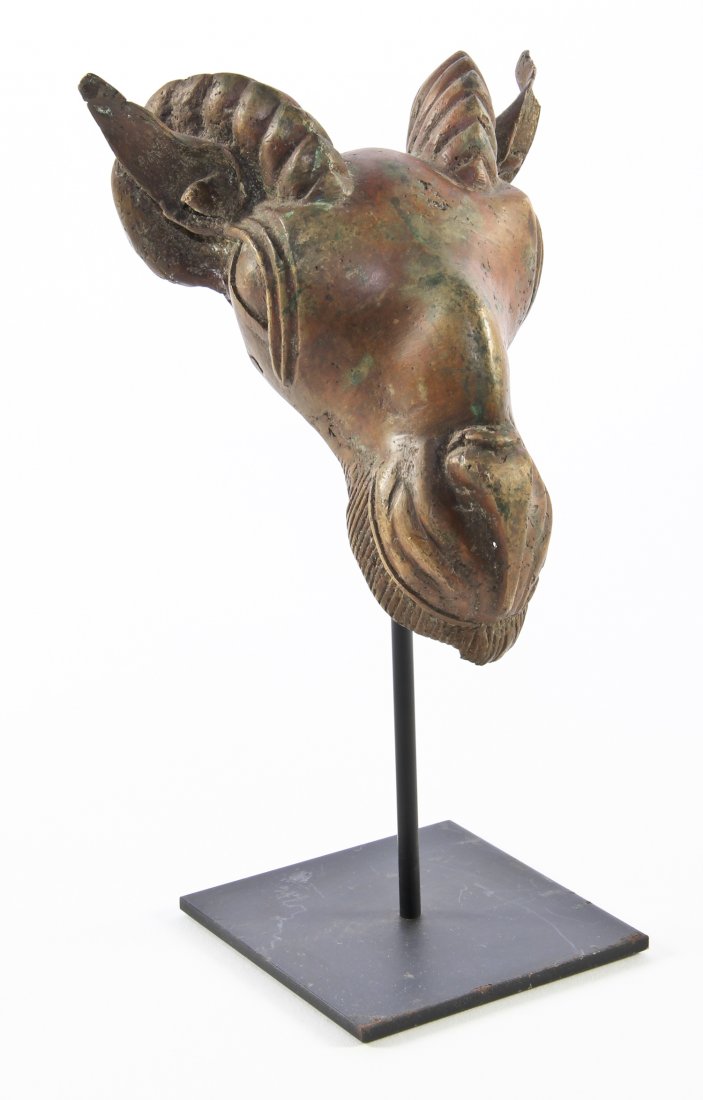 Bronze Ram's Head Mask on Stand- Possibly Benin: Bronze Ram's Head Mask on Stand. Possibly Benin. Patinated. Size: 10.5" x 5.75" x 4.75" (27 x 15 x 12 cm). Provenance: Max Garb, Chicago, Illinois.