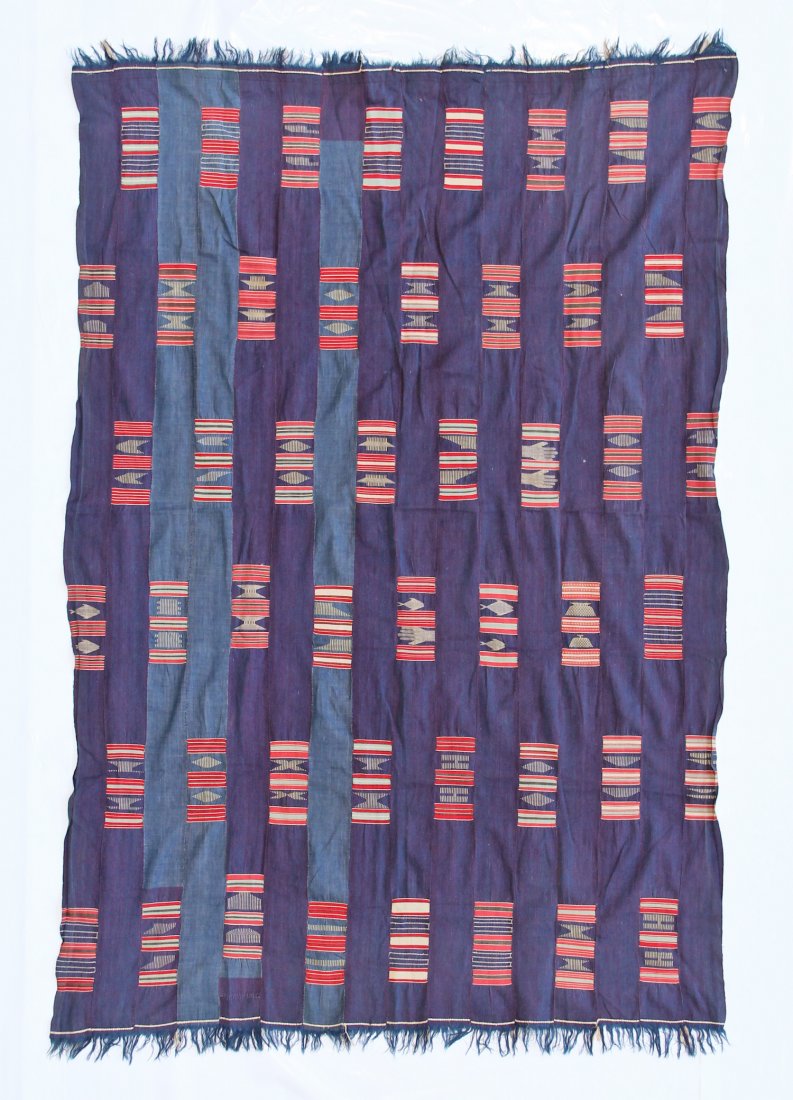 Ewe Cloth: Ewe Cloth, indigo with red, light yellow, light blue weft inserts. Strip woven, Togo or Benin, 40-50 years old. Size: 4'3" x 6'4" (129 x 192 cm). Provenance: a Gentleman in California.