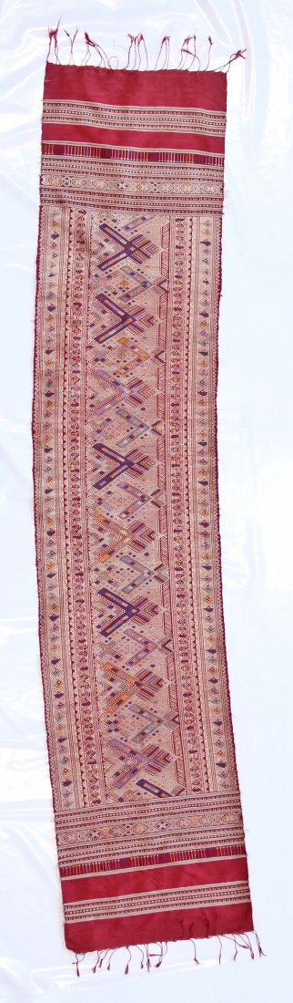 Asian Silk Embroidery: Laos, Xam Nena wall-hanging by Tai Deng Ethnic Group, mid 20th c. Embroidery on red silk background. Size: 1'5" x 6'6" (43 x 198 cm). Provenance: a Gentleman in California.