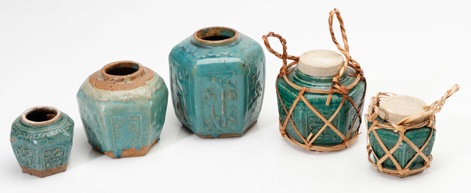 Group of 5 Teal-Glazed Pottery Ginger Jars: Group of 5 Teal-Glazed Pottery Ginger Jars. Size: from: 4'' x 4'' x 2'' (10 x 10 x 5 cm) to 7'' x 6'' x 3'' (18 x 15 x 8 cm). Provenance: Private Philadelphia Estate Collection.