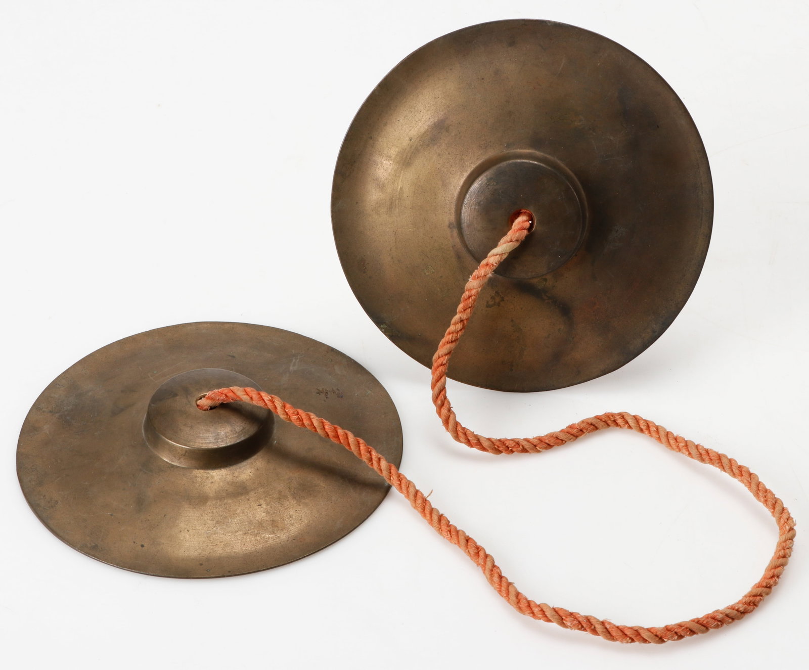 Antique Himalayan Tingsha Cymbals: Antique Himalayan Tingsha Cymbals. Brass cymbals with a textile cord. Size: 6.25'' x 6.25'', 16 x 16 cm (cymbal); 30.5'', 77 cm (total length).