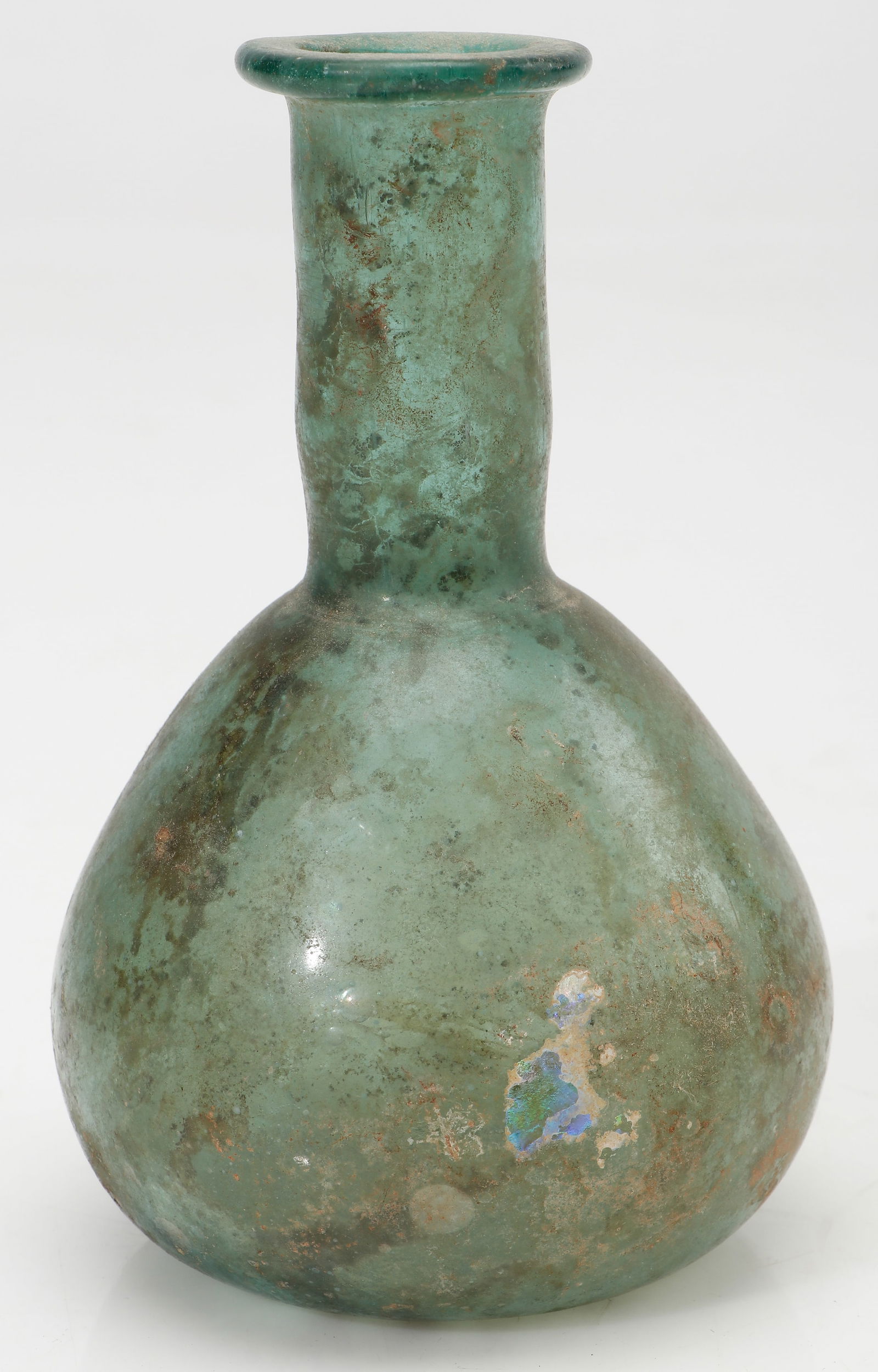 Ancient Roman Green Glass Bottle: Ancient Roman Green Glass Bottle. Size: 5'' x 3'' x 3'' (13 x 8 x 8 cm). Provenance: Private Philadelphia Estate Collection.