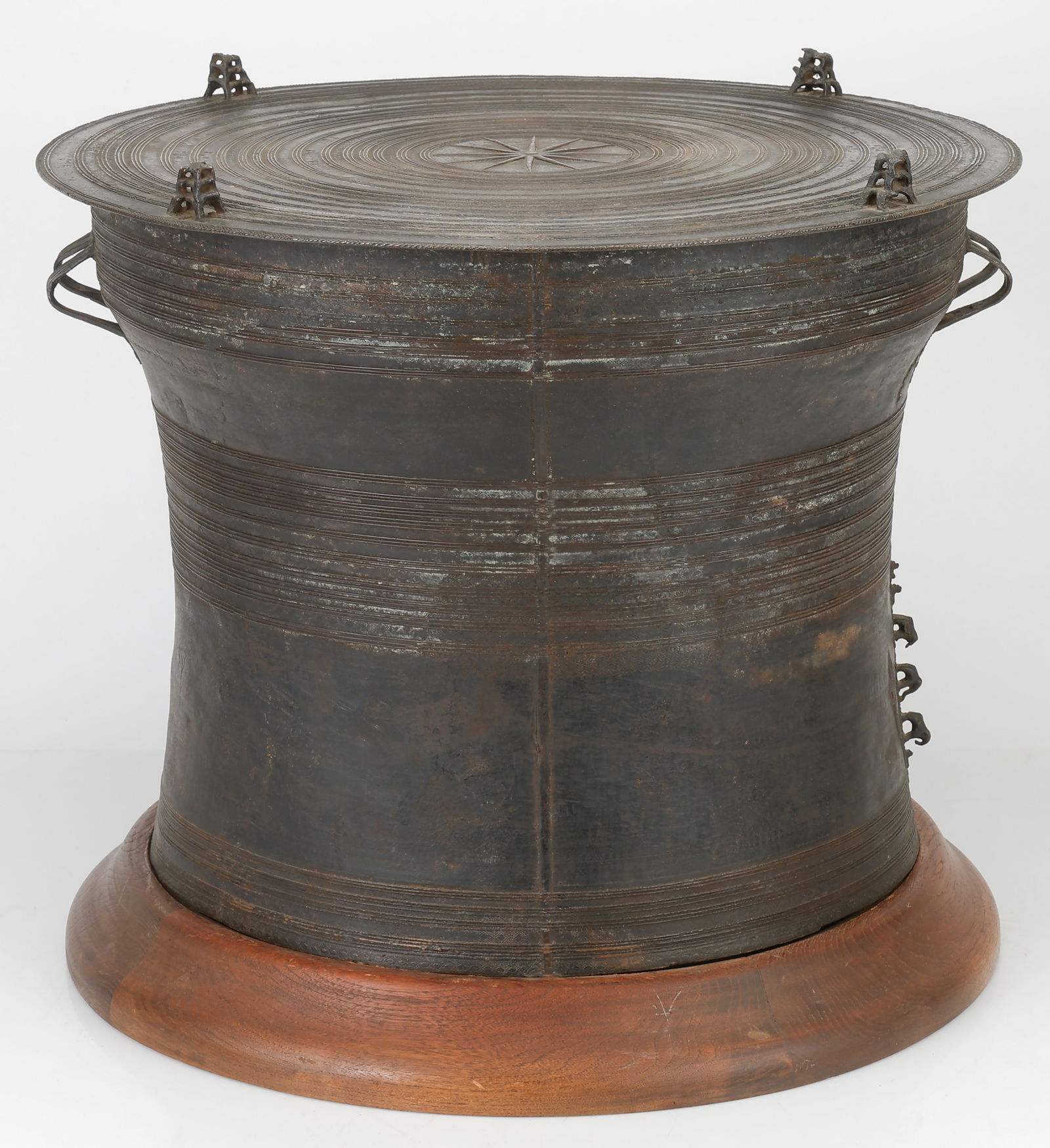 Chinese Shan Bronze Rain Drum: Chinese Shan Bronze Rain Drum. With two pairs of loop handles, decorated with thin bands of shallow geometric patterns in shallow relief, the top with similar concentric circle bands centering a star
