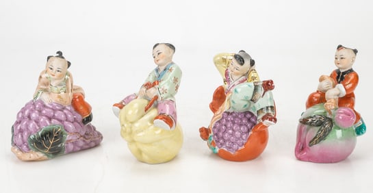 4 Chinese Porcelain Figures Of Children Riding Fruits
