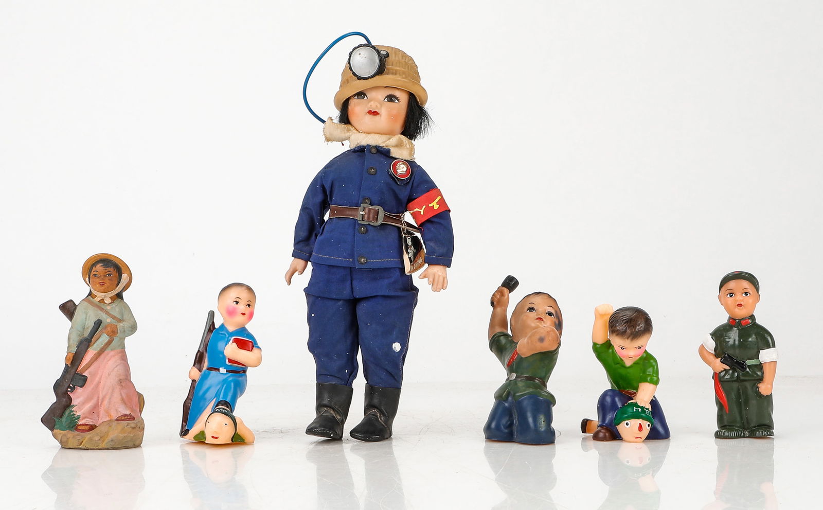Collectors Lot Of 6 Cultural Revolution Era Toys: Collectors Lot Of 6 Cultural Revolution Era Toys. One larger female doll dressed in a mining uniform, a farmer holding a gun, and a pair of Little Red Guard rubber toys, c.1969. One Red Guard figure h
