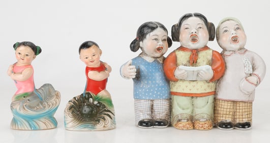 Ceramic Figures of Children Singing and 2 Fantasy Figurines of a Boy and a Girl