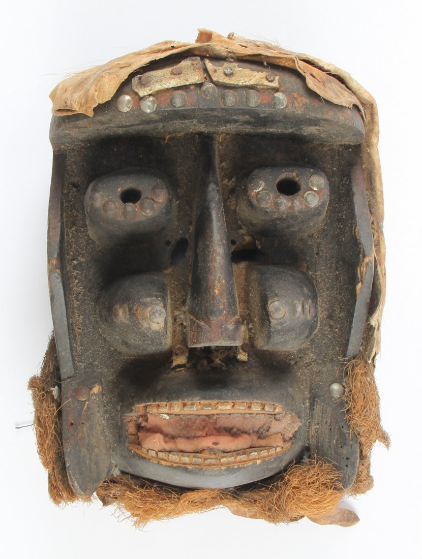 African Bete Mask: African Bete Mask. Carved wood, hide, fiber, tacks. Size: 11" x 8" x 6" Provenance: Max Garb, Chicago, Illinois.