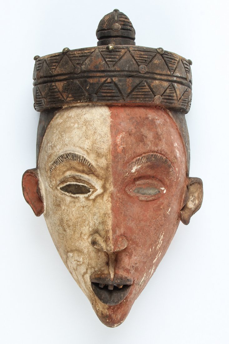 African Kongo Mask: Kongo Mask. Carved wood, kaolin paint, glass, and metal tacks. Size: 11.5" x 6.5" x 4.5". Provenance: Max Garb, Chicago, Illinois.