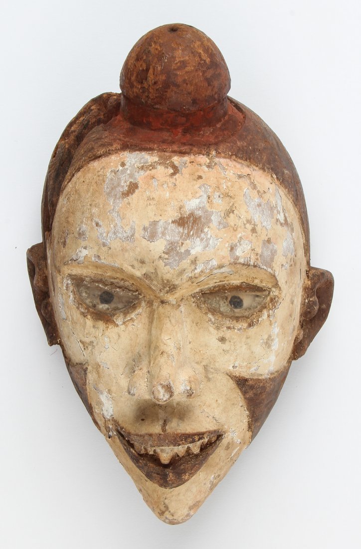 African Kongo Mask: Kongo Mask. Carved and painted wood, glass shard eyes. Size: 10" x 6" x 5". Provenance: Max Garb, Chicago, Illinois.