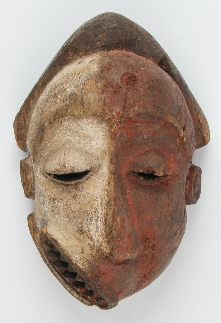 African Pende Mbangu Mask: Pende Mbangu (Sickness) Mask. Carved and painted wood. Size: 11" x 7.5" x 4". Provenance: Max Garb, Chicago, Illinois.