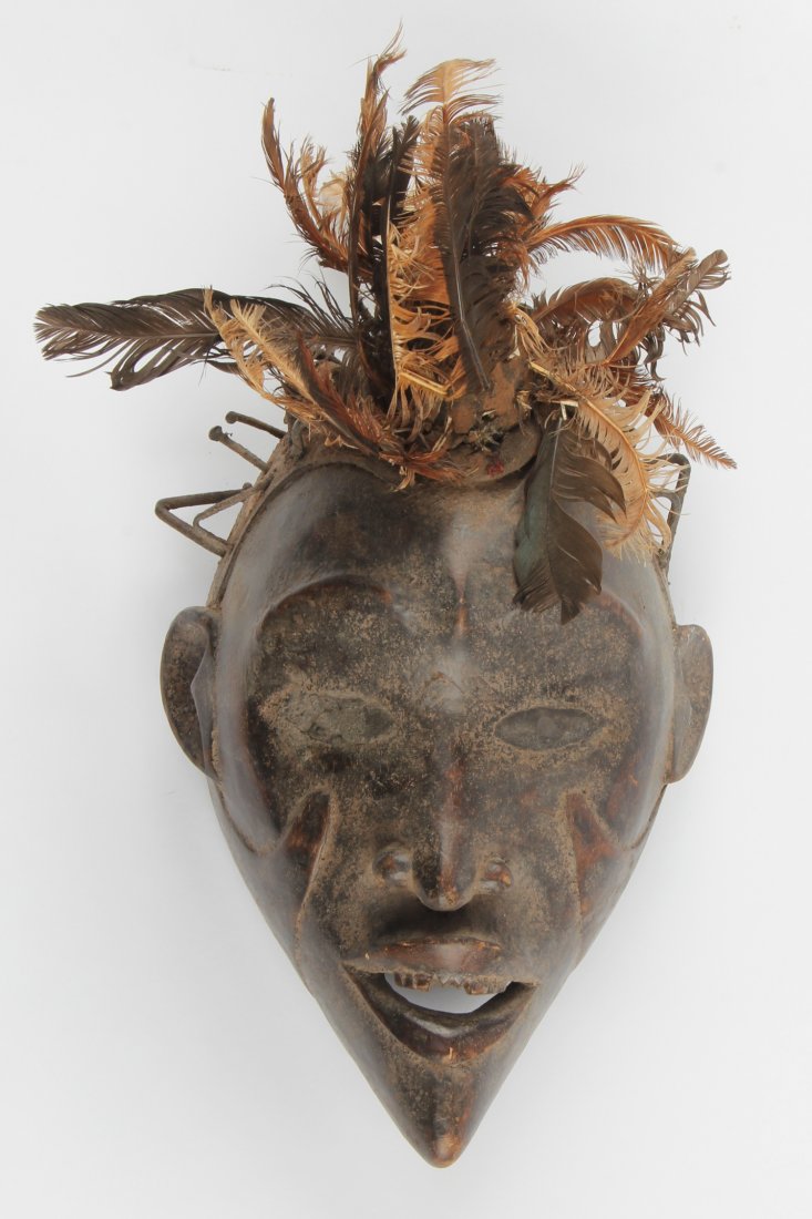 Plumed Kongo Mask: Plumed Kongo Mask. Carved wood, feathers, fabric and glass eyes. Size: 12.5" x 9" x 6.5". Provenance: Max Garb, Chicago, Illinois.