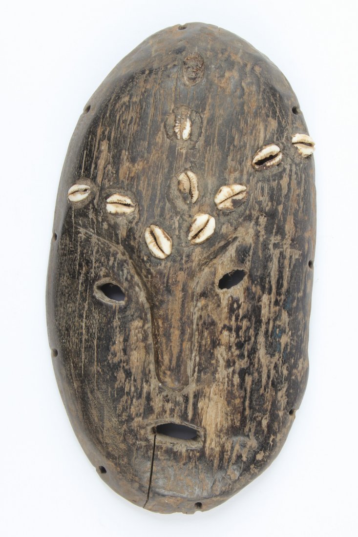 Old Lega Flat Mask: Lega Mask; very old. Carved wood, shells. Size: 10" x 5.5" x 1". Provenance: Max Garb, Chicago, Illinois.