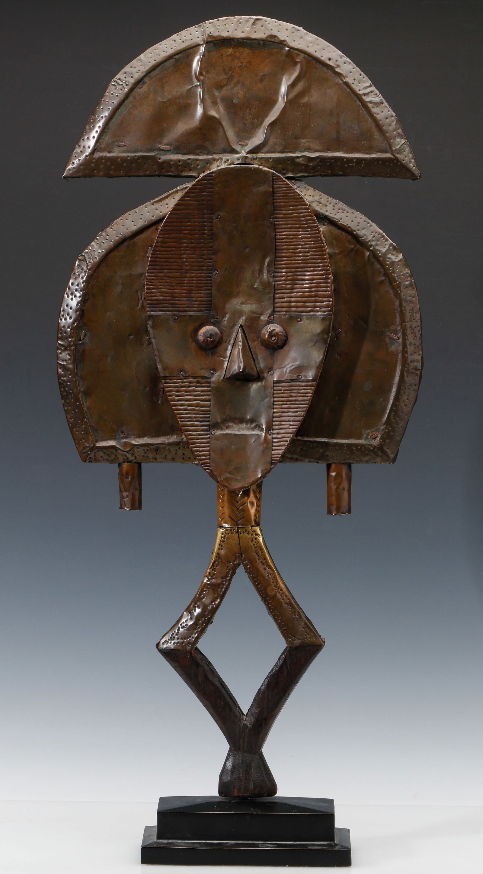 Bakota Reliquary Guardian Figure, Gabon, 19th C.: Bakota Reliquary Guardian Figure, Gabon, 19th C. Sculpture in wood and brass/copper alloy. On stand. Reliquary figures of this kind are known as Mbulu Ngulu. Size: 30'' x 14'' x 2.75'' (76 x 36 x 7 cm