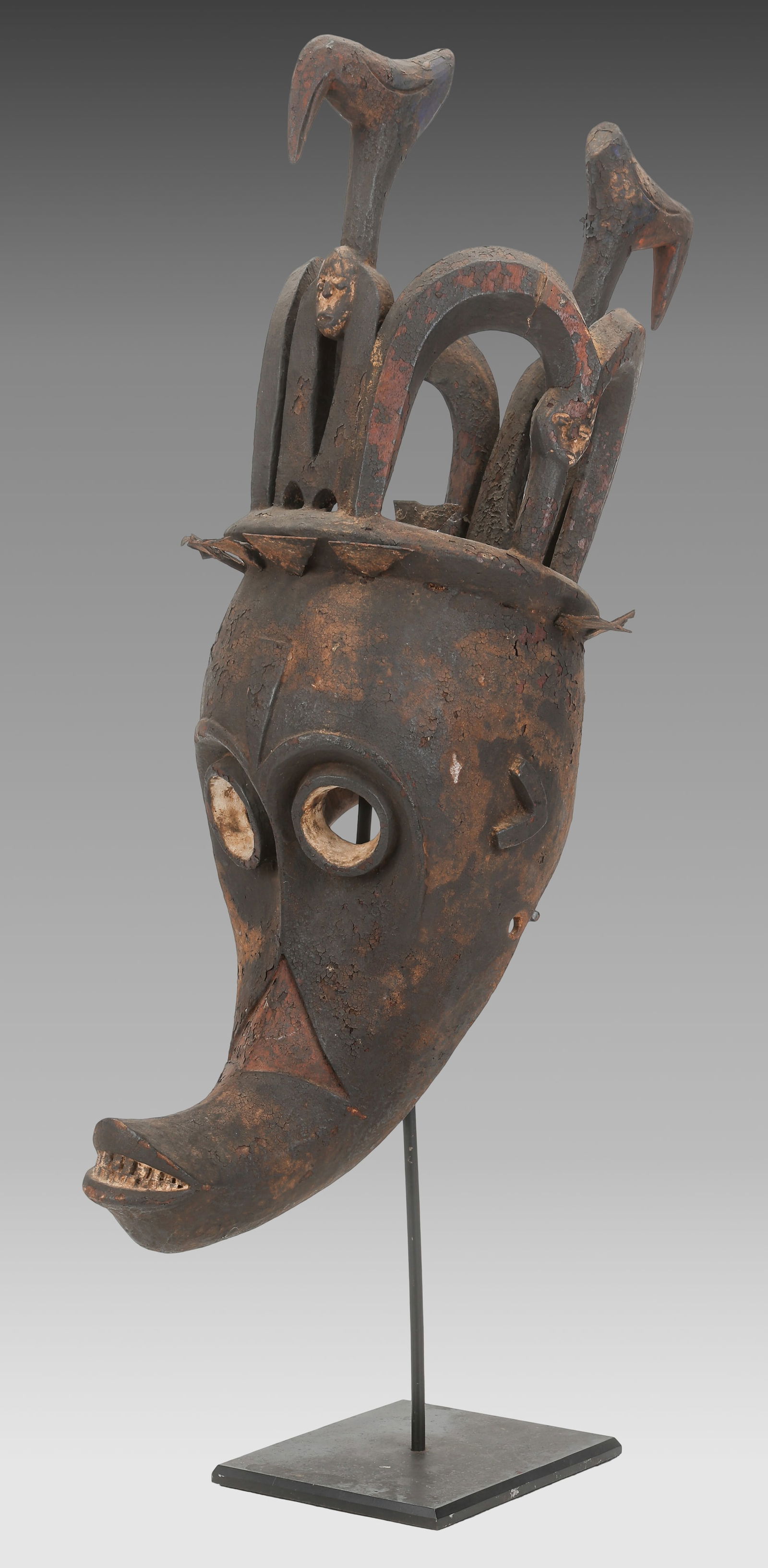 Rare Mgbedike Mask, Igbo People, Nigeria: Rare Mgbedike Mask, Igbo People, Nigeria. Stand included. Size: 28.5'' x 10.5'' x 14'' (72 x 27 x 36 cm), Height on stand: 38'' (97 cm). Provenance: ex collection Daniel "Danny" Simmons, Jr.