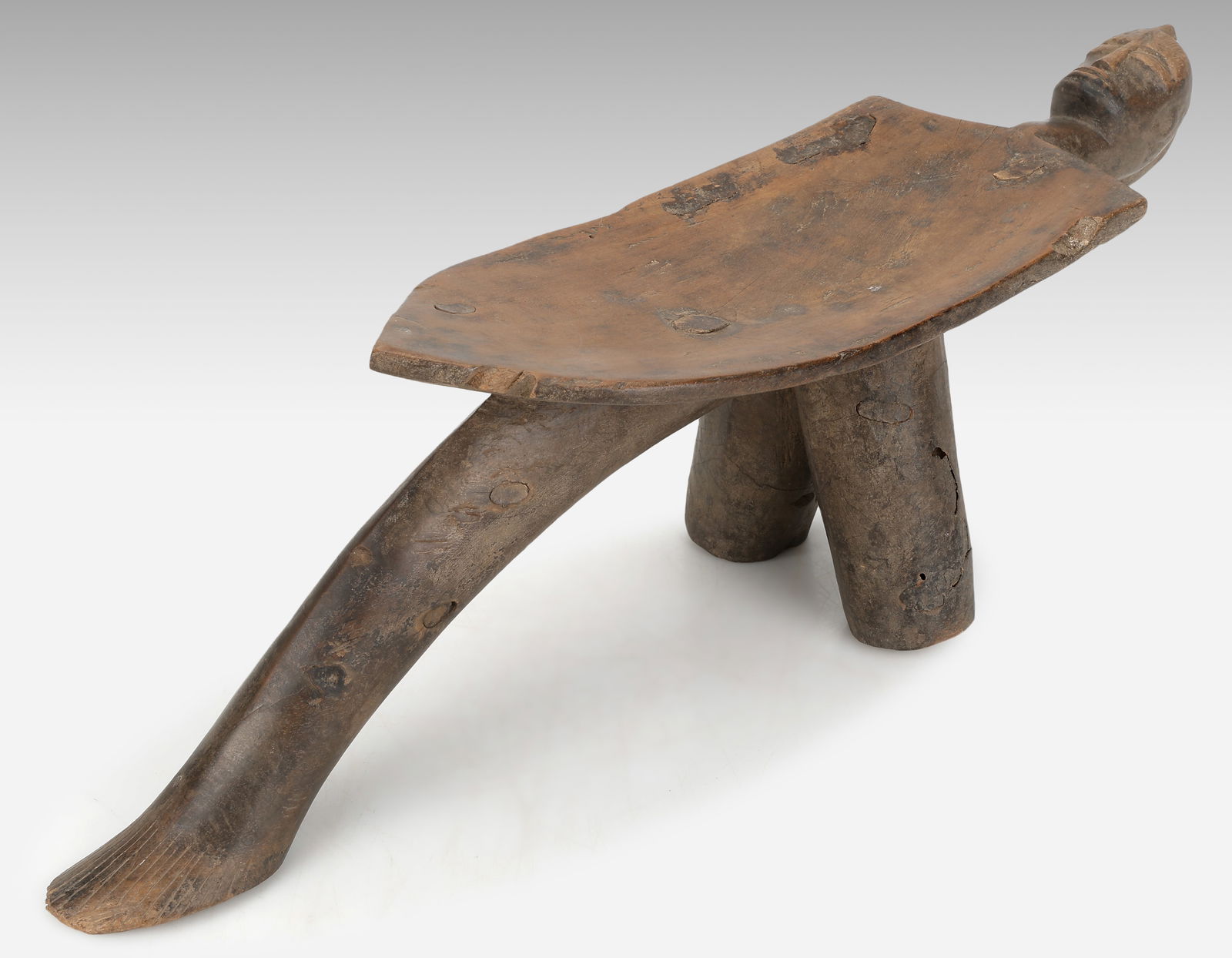 Lobi Stool, Burkina Faso: Lobi Stool, Burkina Faso. Carved wood. Size: 7'' x 22.2'' x 5.5'' (18 x 56 x 14 cm). Provenance: ex Michelle Gilbert Trust.