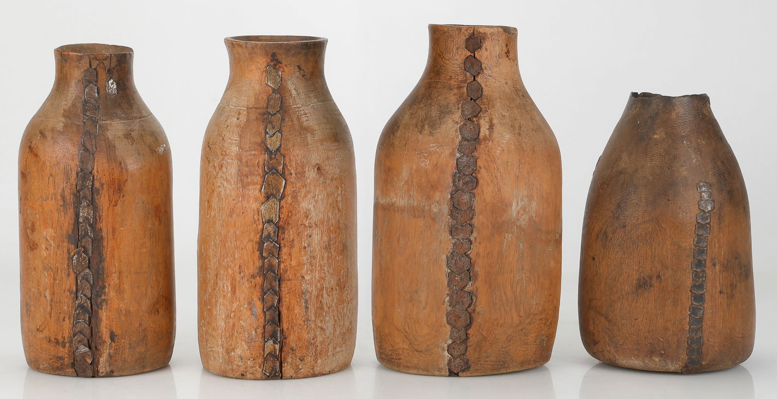 Collection of 4 African Wooden Milk Containers, Tutsi People, Eastern Congo, Rwanda or Burundi: Collection of 4 African Wooden Milk Containers, Tutsi People, Eastern Congo, Rwanda or Burundi. With indigenous repairs. Heights from 9.5" - 12.5" (24 cm - 32 cm).