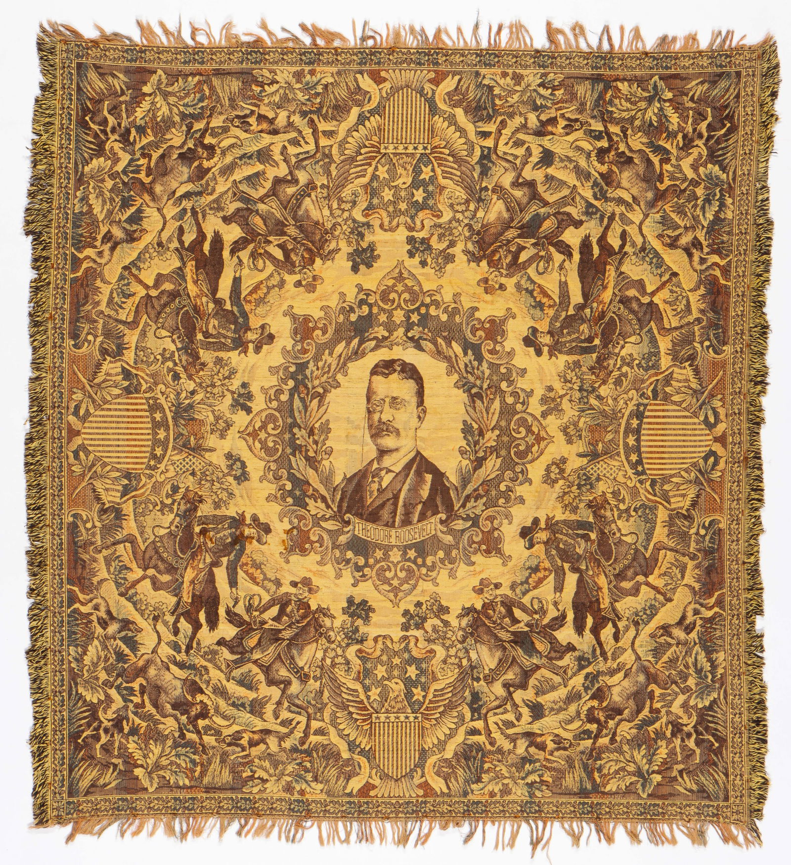 President Theodore Roosevelt Tapestry, Early 1900s: Political Presidential Memorabilia. Early 1900s.Antique Teddy Roosevelt And The Rough Riders Tapestry. Centering a portrait of Roosevelt within a wreath and cowboy Rough Riders on each corner. Wool wi