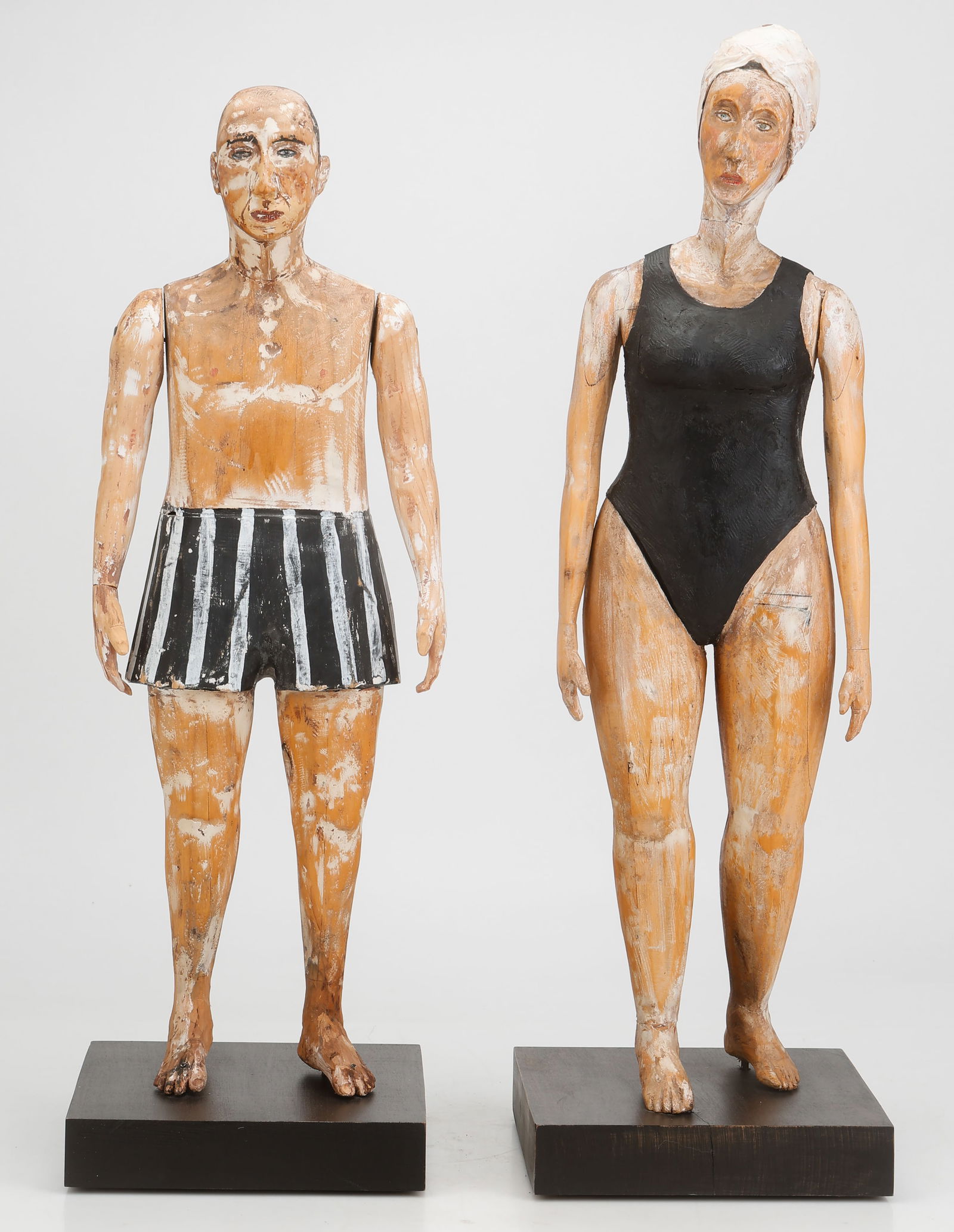 Joe Brubaker (American, B.1948) Pair Of Folk Art Sculptures Of Bathers: Joe Brubaker (American, B.1948) Pair Of Folk Art Sculptures Of Swimmers, Bathers. 1) "Margaret," 1998, carved wood and paint, titled, signed: JB and dated on foot. Height: 27" (69 cm). Height on base: