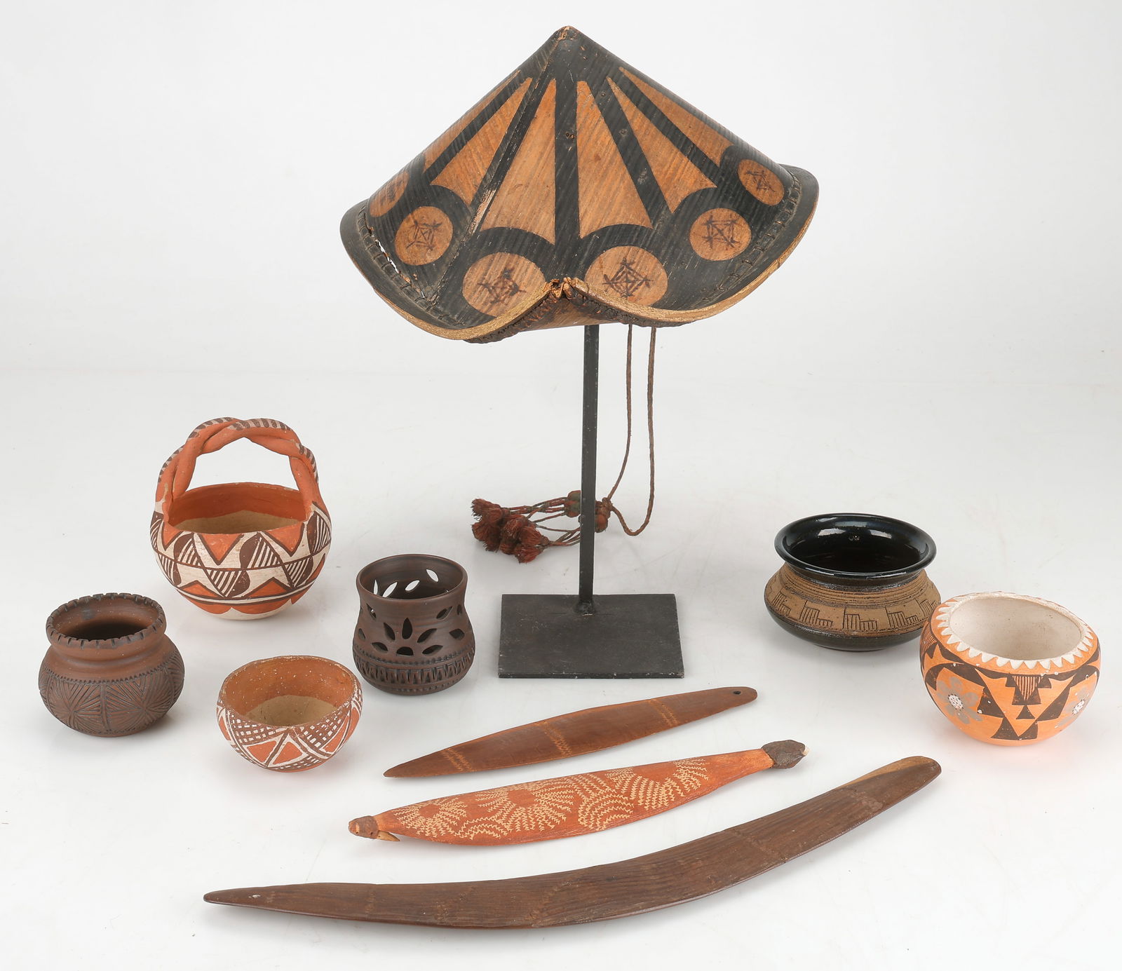 Collector's Lot of 10 Ethnographic Items: Collector's Lot of 10 Ethnographic Items. Including two Australian Aboriginal bull-roarers, one boomerang, and one Filipino salakot hat. Sizes From: 9.5'' x 2'', 24 x 5 cm; To: 6.5'' x 12'' x 14'' (17