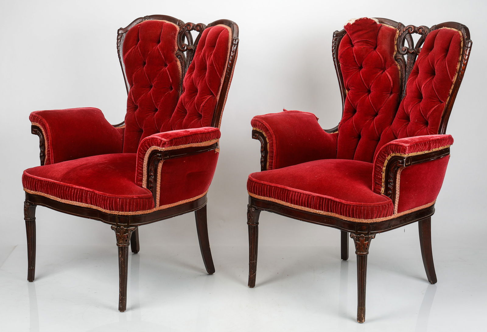Pair of Victorian Grandfather Chairs: Pair of Victorian Grandfather Chairs. Upholstered in red velvet, with split back wooden detailing. Each Size: 41'' x 30'' x 24'' (104 x 76 x 61 cm). Provenance: Private Philadelphia Estate Collection.