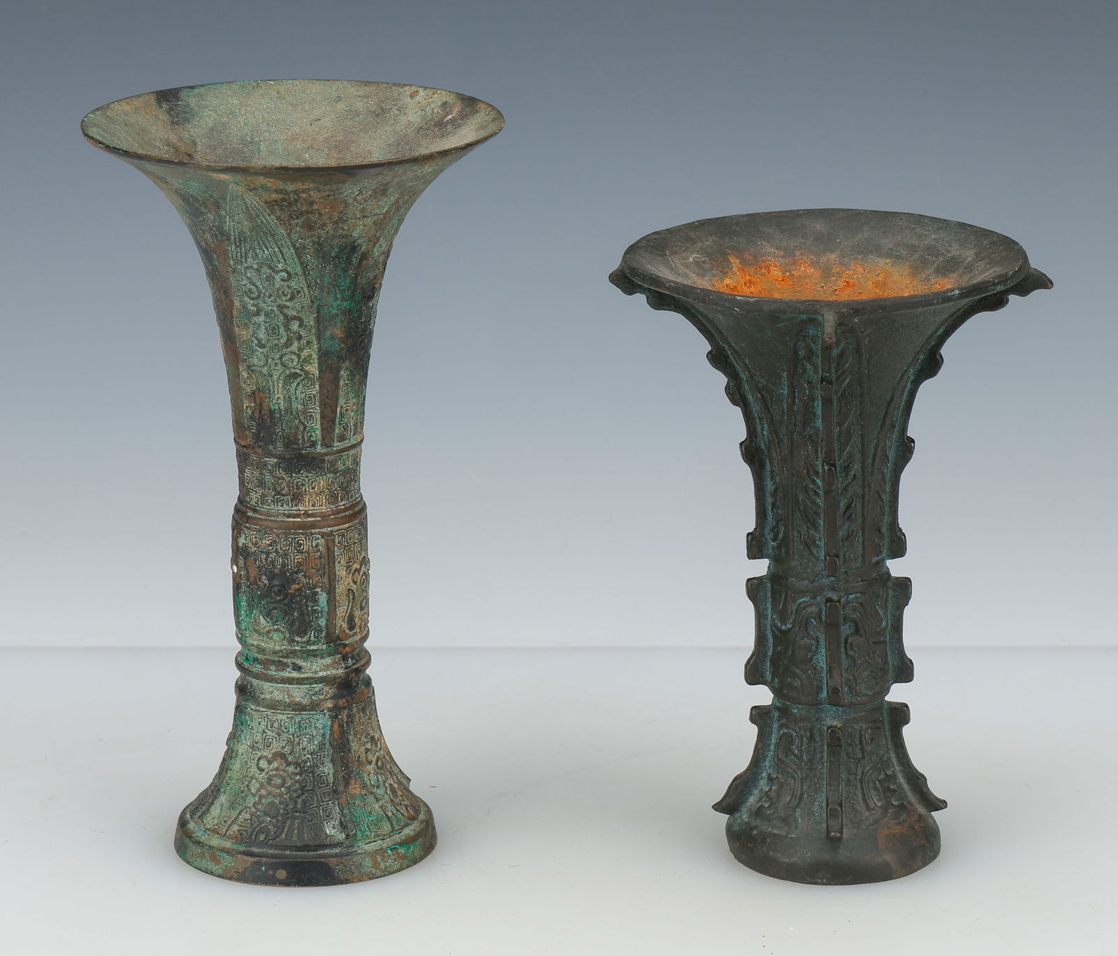 2 Chinese Archaistic Bronze Gu Vases: 2 Chinese Archaistic Bronze Gu Vases. Sizes: 1) 7'' x 4.5'' x 1'' (18 x 11 x 3 cm); 2) 8'' x 4.5'' x 1.5'' (20 x 11 x 4 cm). Provenance: Private Philadelphia Estate Collection.