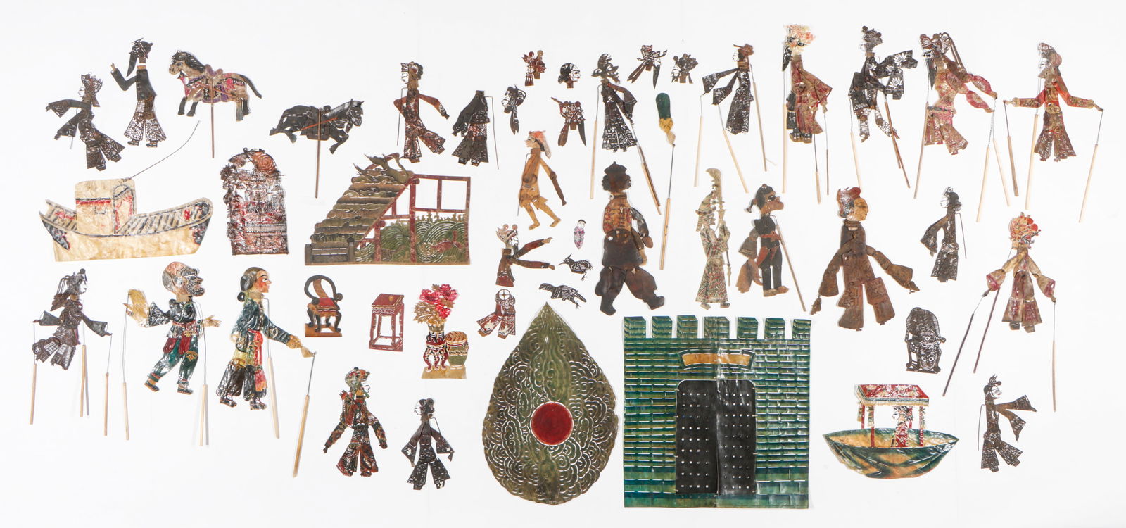 Collector's Lot of Chinese Shadow Puppets.: Collector's Lot of Chinese Shadow Puppets. 56 pieces.Sizes From: 3'' x 4'' (8 x 10 cm); To: 21.5'' x 20.5'' (55 x 52 cm). Provenance: From the Nina Sidley Collection of International Textiles and Folk
