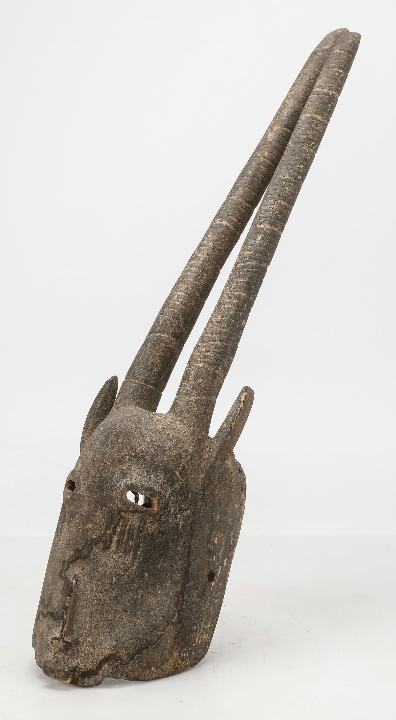African Dogon Antelope Mask, Mali, H: 32": African Dogon Antelope Mask, Mali. Carved wood. Size: 32'' x 7'' x 8'' (81 x 18 x 20 cm).
