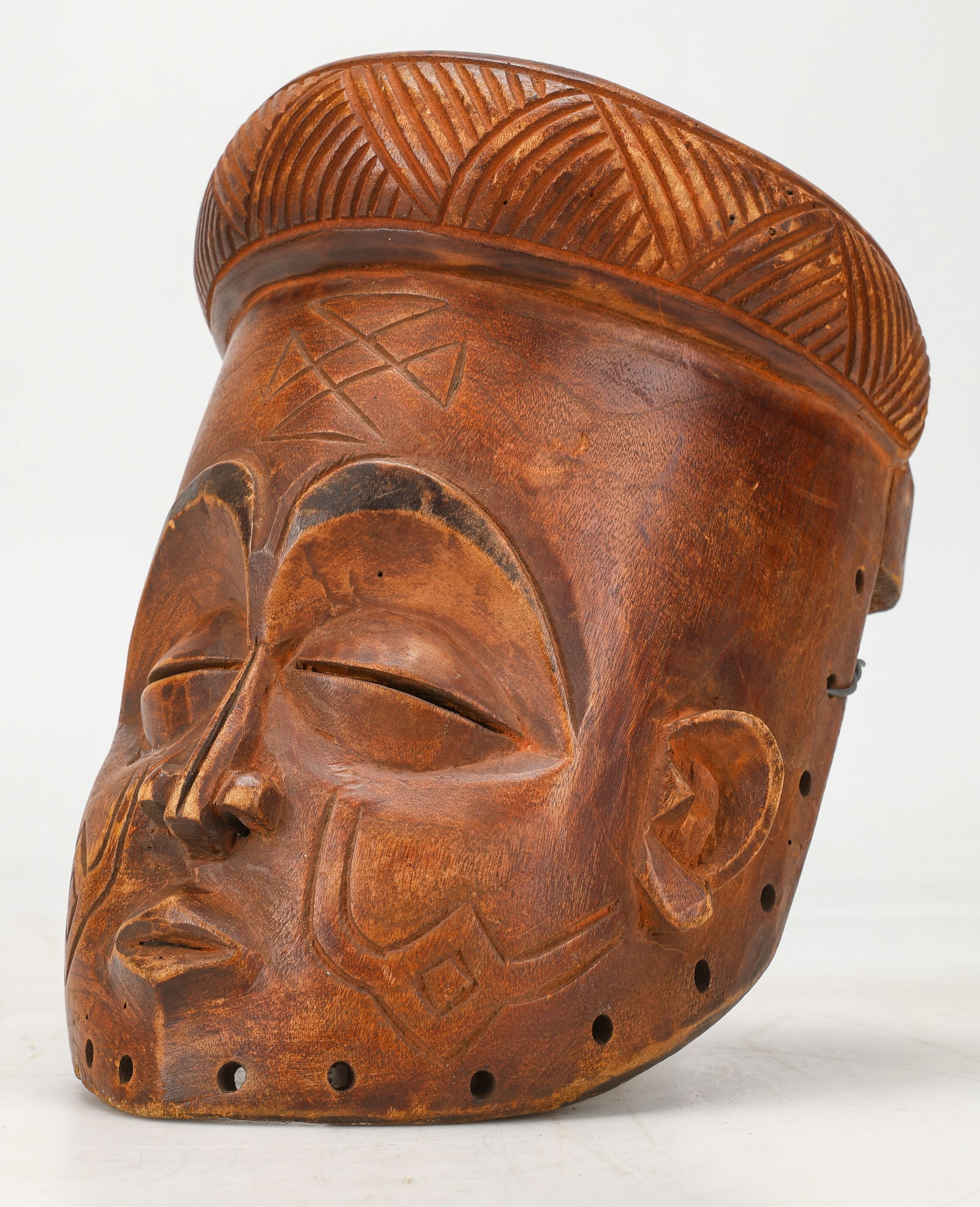 African Lwena Style Mask: African Lwena Style Mask. Carved wood. Size: 10'' x 7'' x 7'' (25 x 18 x 18 cm).