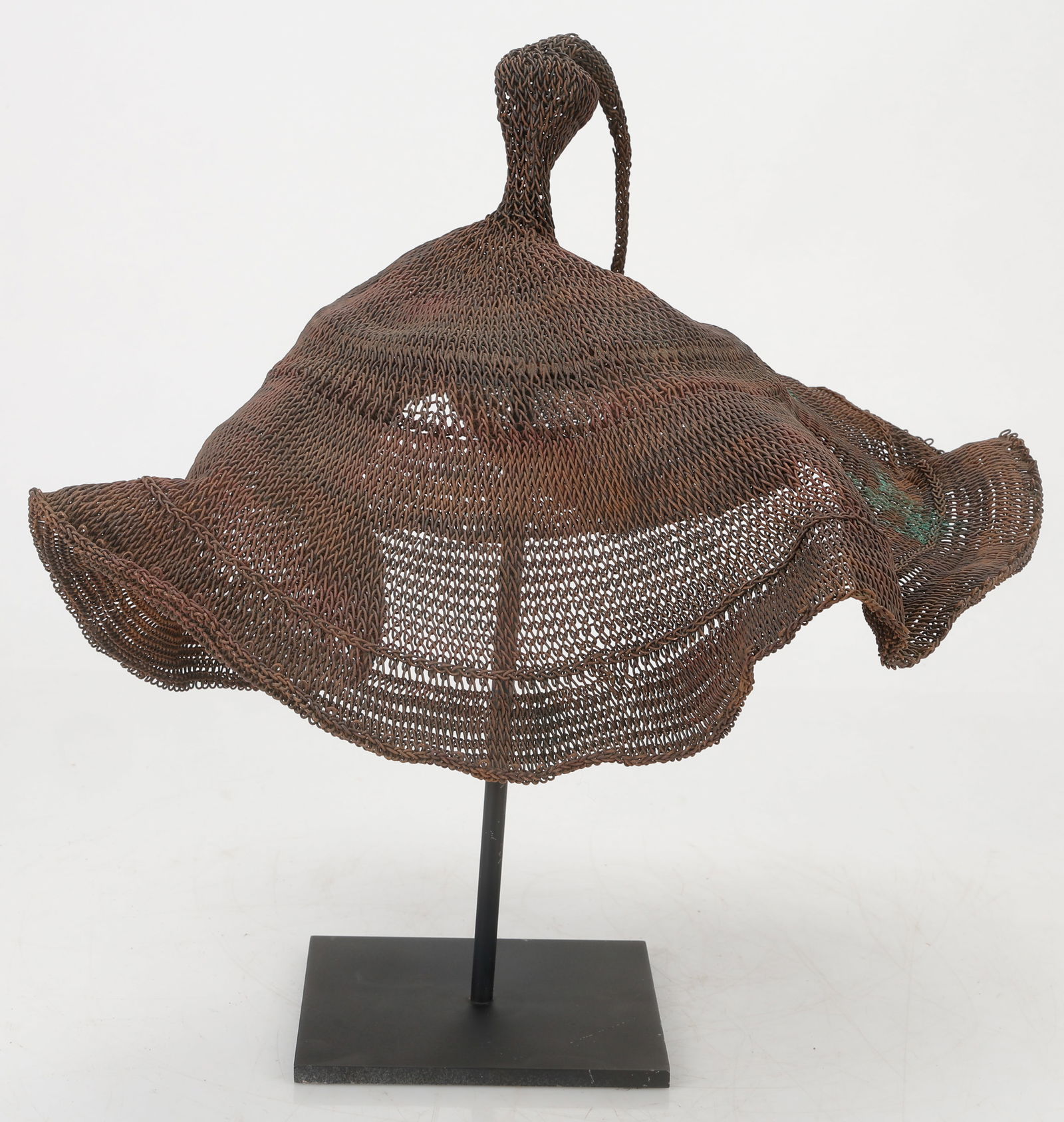 Indonesian Copper Mesh Hat, Sumba: Indonesian Copper Mesh Hat, Sumba. On stand. Diameter: 14: (36 cm); Height On Stand: 14" (36 cm).
