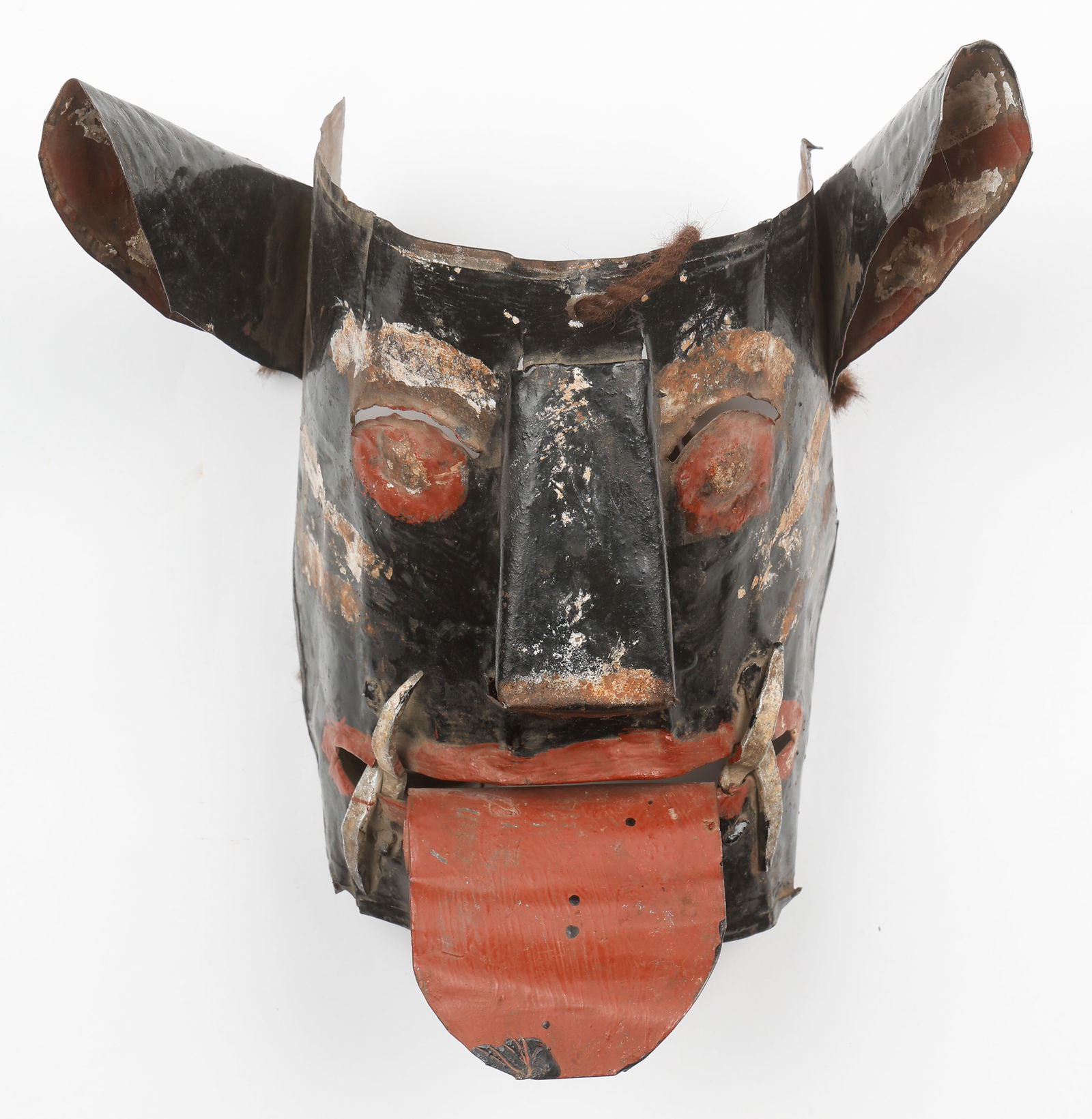 Bolivian Tin Bull Carnival Dance Mask, Early 20th C.: Bolivian Tin Bull Carnival Dance Mask, Early 20th C. Sacaca, Department of Potosi. Bolivia. Painted Tin. Early 20th Century. Size: 8'' x 9'' x 5'' (20 x 23 x 13 cm).