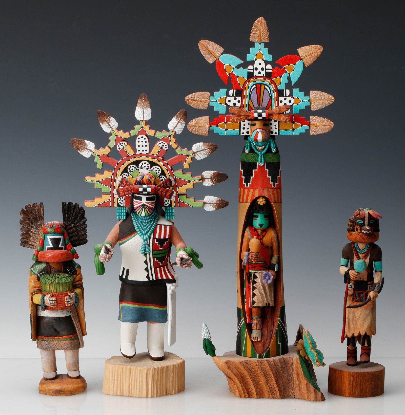 Group Of Four Modern Kachina Style Dolls: Group Of Four Modern Kachina Style Dolls. Included is a Honan (Badger) figure by Jocelyn Vote Honani (her signature also features an inscribed bear claw to denote her clan origin). This lot also inclu