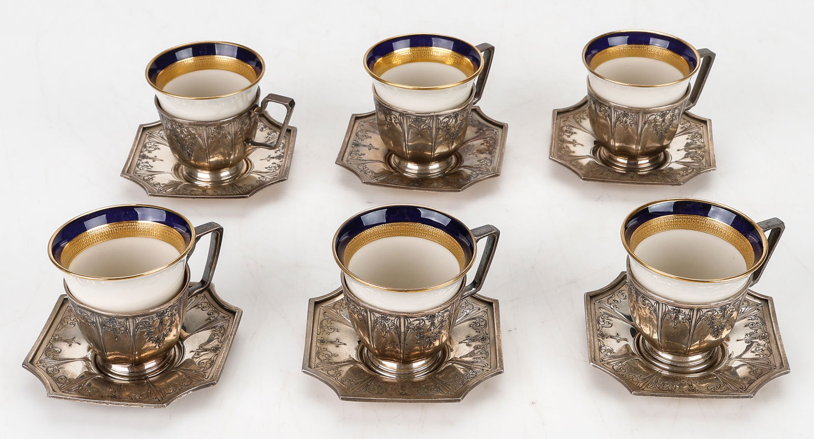 6 International Silver Co. Sterling Demitasse Cups With Porcelain Liners.: 6 International Silver Co. Sterling Demitasse Cups And Saucers With Porcelain Liners. marked; I.S. Co Sterling. Each Size: 2'' x 3'' x 3'' (5 x 8 x 8 cm). Total Silver Weight: 16 ozt.